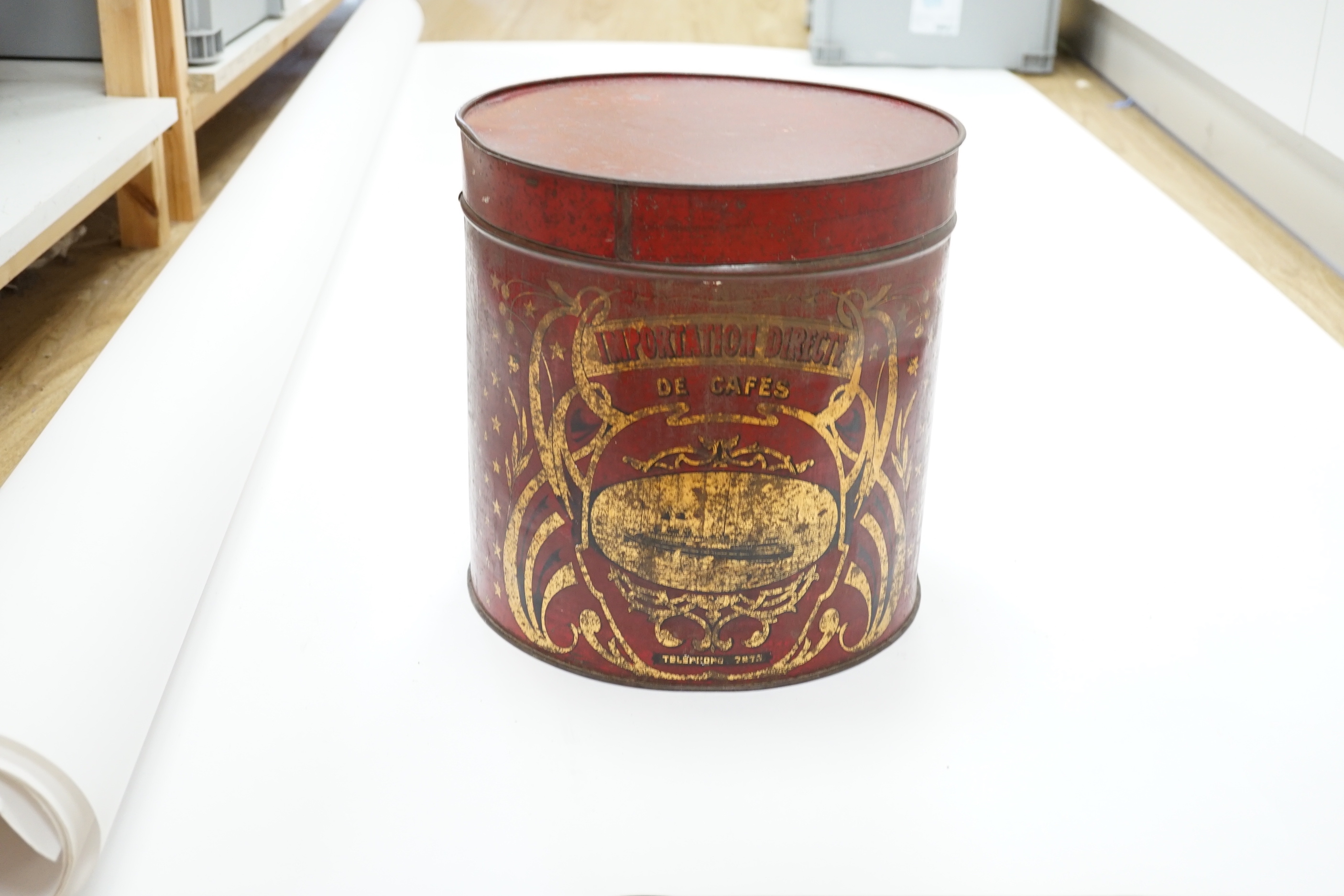 A cylindrical French Toleware coffee tin, 31cm high